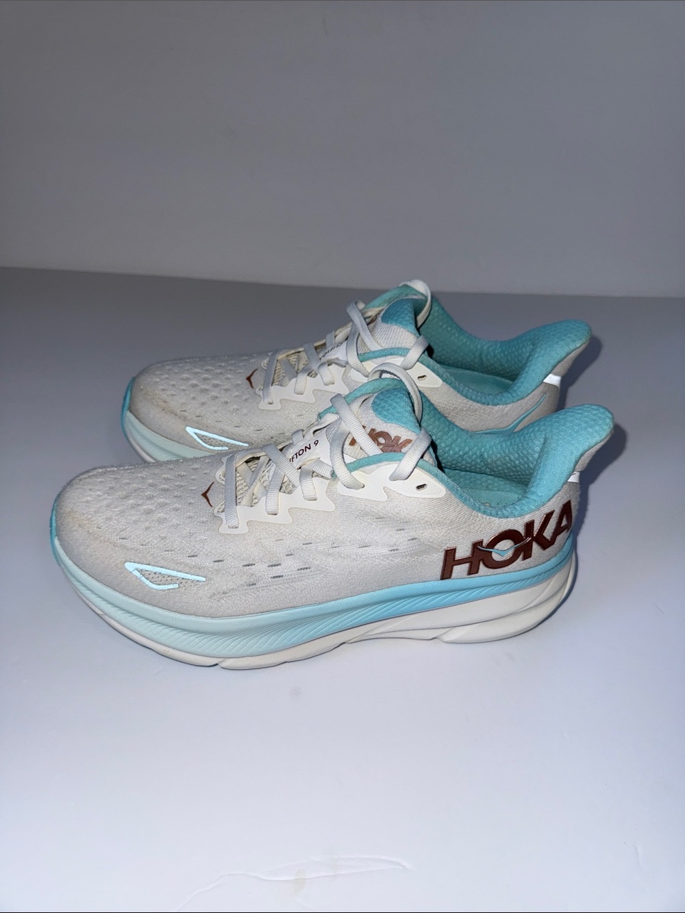 Hoka Clifton 9 White and Light Blue Sneakers with Red Logoe